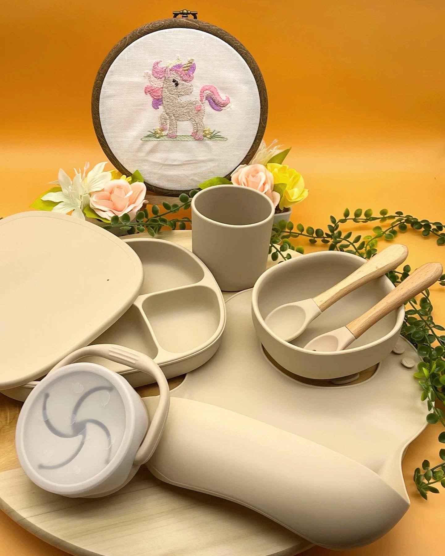 Personalised nude silicone baby feeding set with suction plate, bib, training cup, and wooden spoons in Qute white vintage keepsake trunk in Doha Qatar
