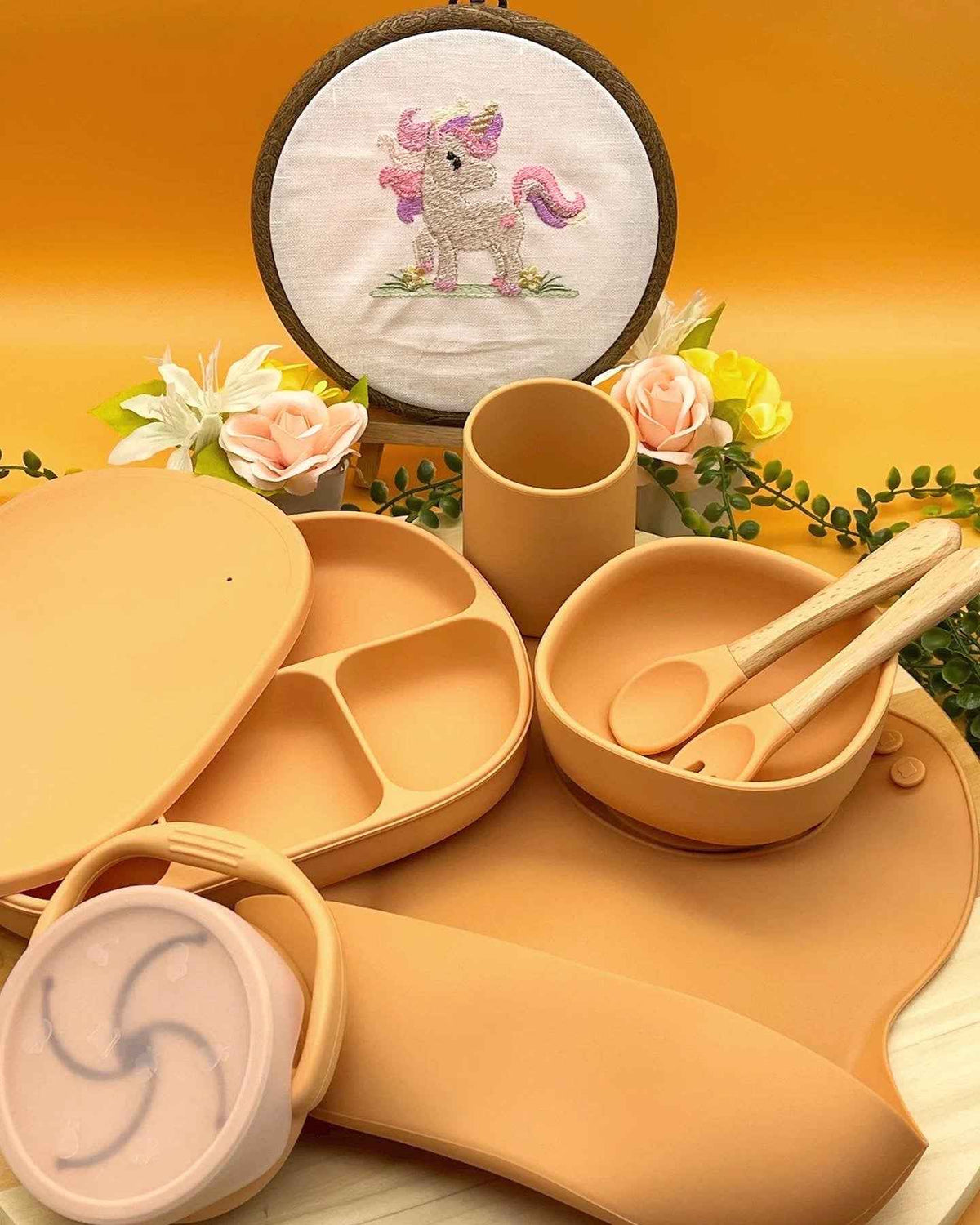Personalised warm caramel silicone gender neutral baby feeding set with floral arrangement, suction plate, snack cup, and engraved spoons in Qute white gift trunk in Doha Qatar