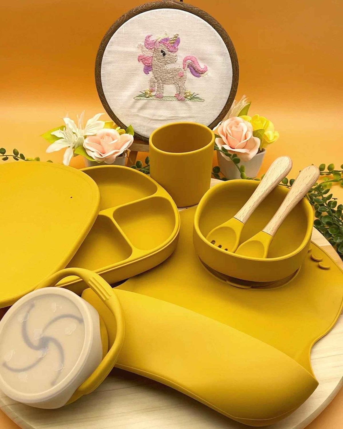 Personalised mango yellow silicone gender neutral baby feeding set with floral arrangement, suction plate, snack cup, and engraved spoons in Qute white gift trunk in Doha Qatar