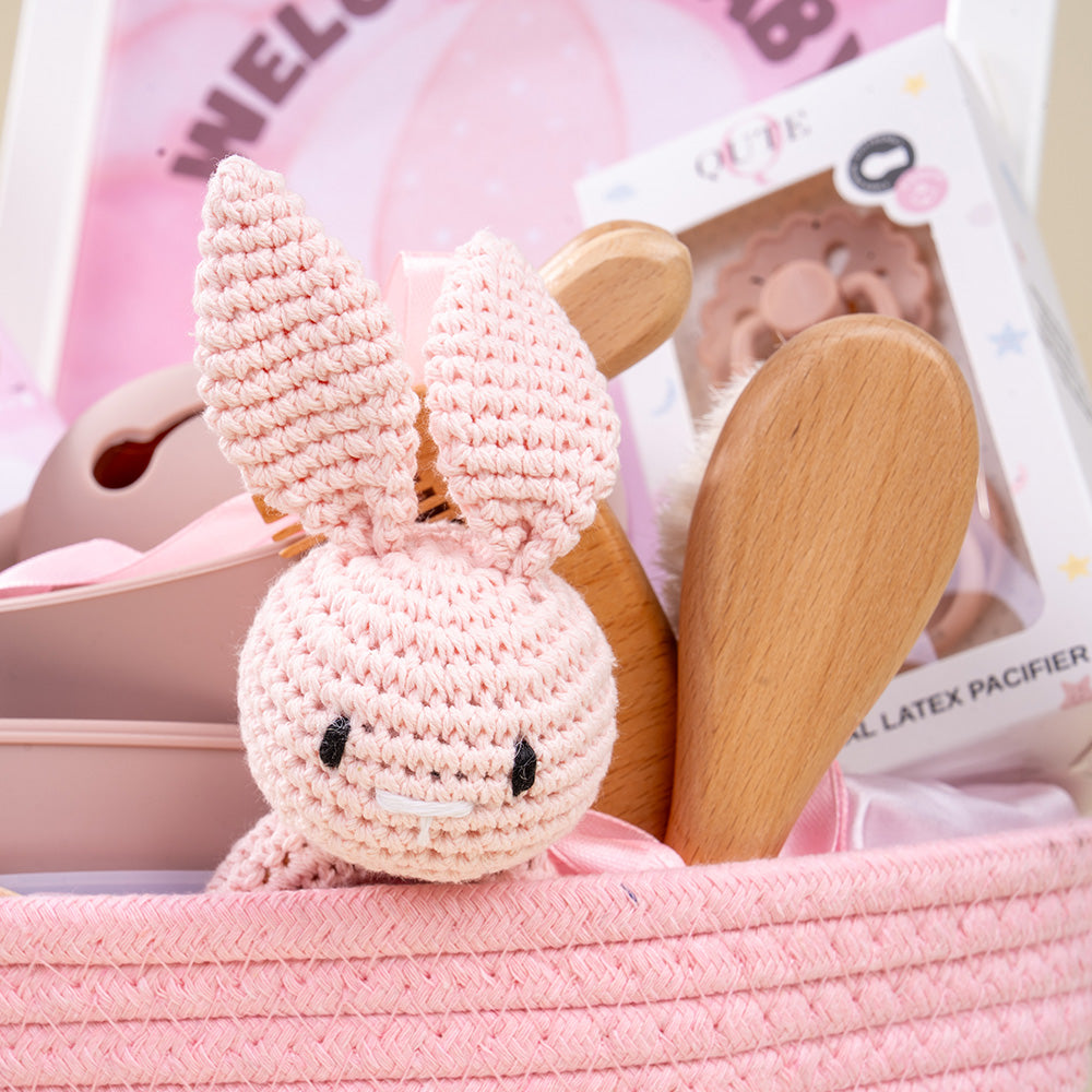Plaza Hollandi x Qute long-lasting baby girl gift basket with pink woven hamper and toddler essentials in Doha Qatar