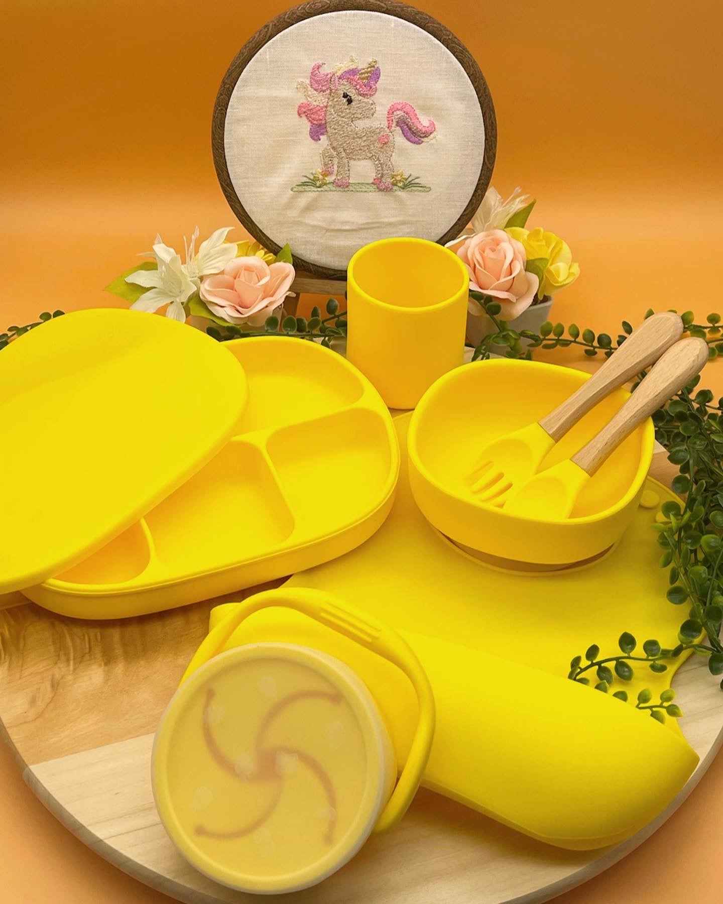 Personalised bright lemon yellow silicone gender neutral baby feeding set with floral arrangement, suction plate, snack cup, and engraved spoons in Qute white gift trunk in Doha Qatar