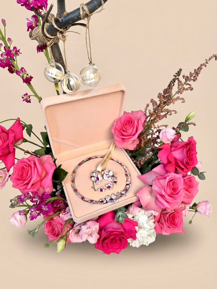 Elara Jewellery anniversary and birthday gift set featuring three secret message bubbles and a luxury pink rose floral base styled by Plaza Hollandi.