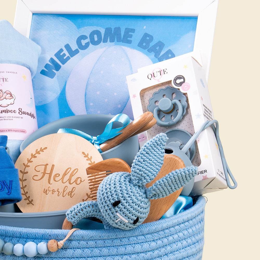 Plaza Hollandi x Qute luxury baby boy gift set with long-lasting essentials and blue woven storage hamper for baby boy gifts in Doha Qatar