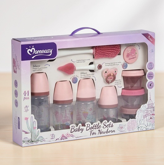 Momeasy 11-piece newborn baby bottle gift set box in pink featuring multiple feeding bottles, silicone bottle brushes, a pacifier, and stacking storage containers with pink lids in Doha Qatar