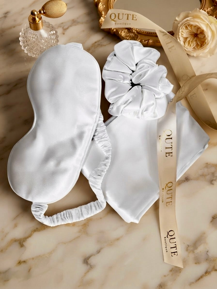Luxury 100% mulberry silk self-care gift set in ivory by Qute Qatar, featuring an ivory silk pillowcase, eye mask, and scrunchie inside a luxury gift box for postpartum and birthday gifting in Doha.