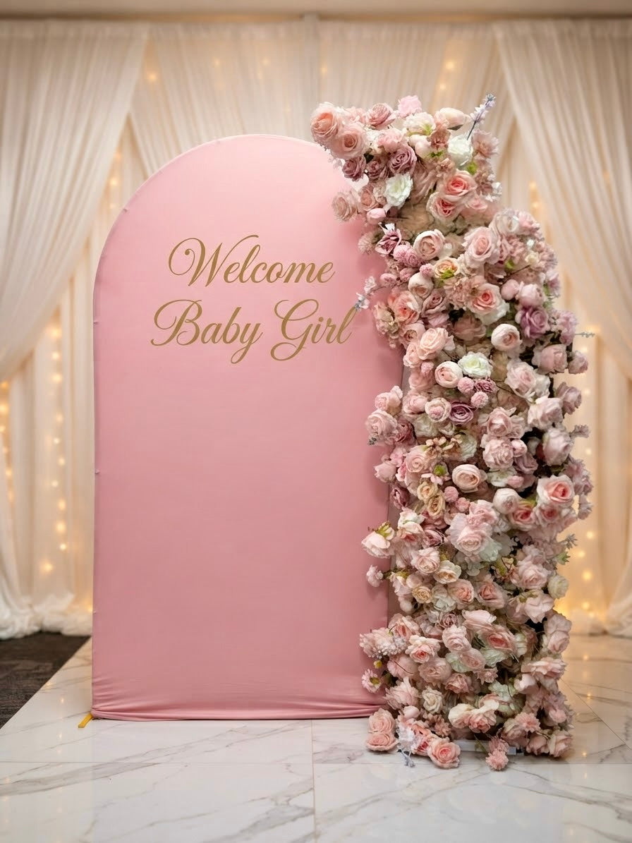Luxury pink faux floral arch backdrop by Qute Qatar, featuring cascading artificial roses and an arched display designed for weddings, engagements, and baby showers in Doha.