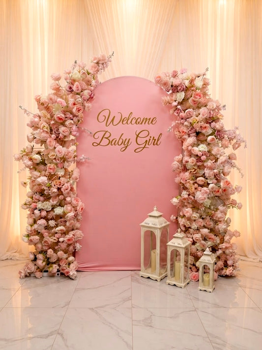 Luxury pink faux floral arch backdrop by Qute Qatar, featuring cascading artificial roses and an arched display designed for weddings, engagements, and baby showers in Doha.